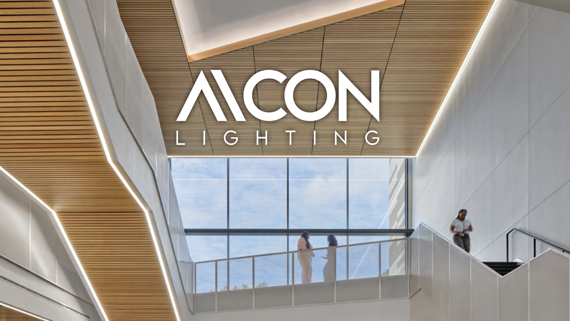 Interior of a school atrium with indirect perimeter lighting that aids in wayfinding while improving visual comfort.